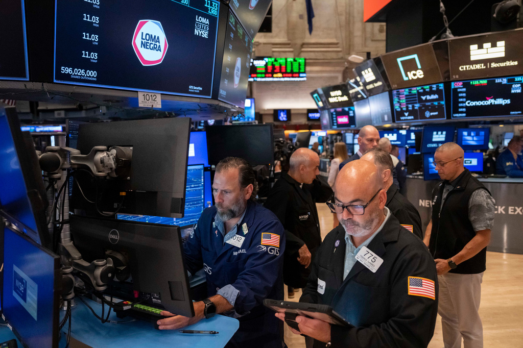 Trader Fred Demarco, right, and Specialist Michael Pistillo, left, work on the floor of the New York Stock Exchange, Friday, Aug. 7, 2026, in New York.