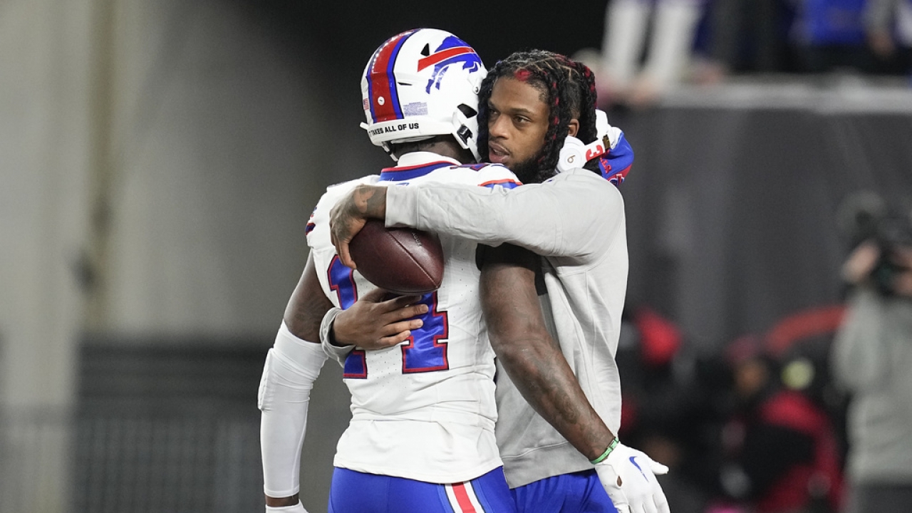 Buffalo Bills wide receiver Stefon Diggs is hugged by safety Damar Hamlin.