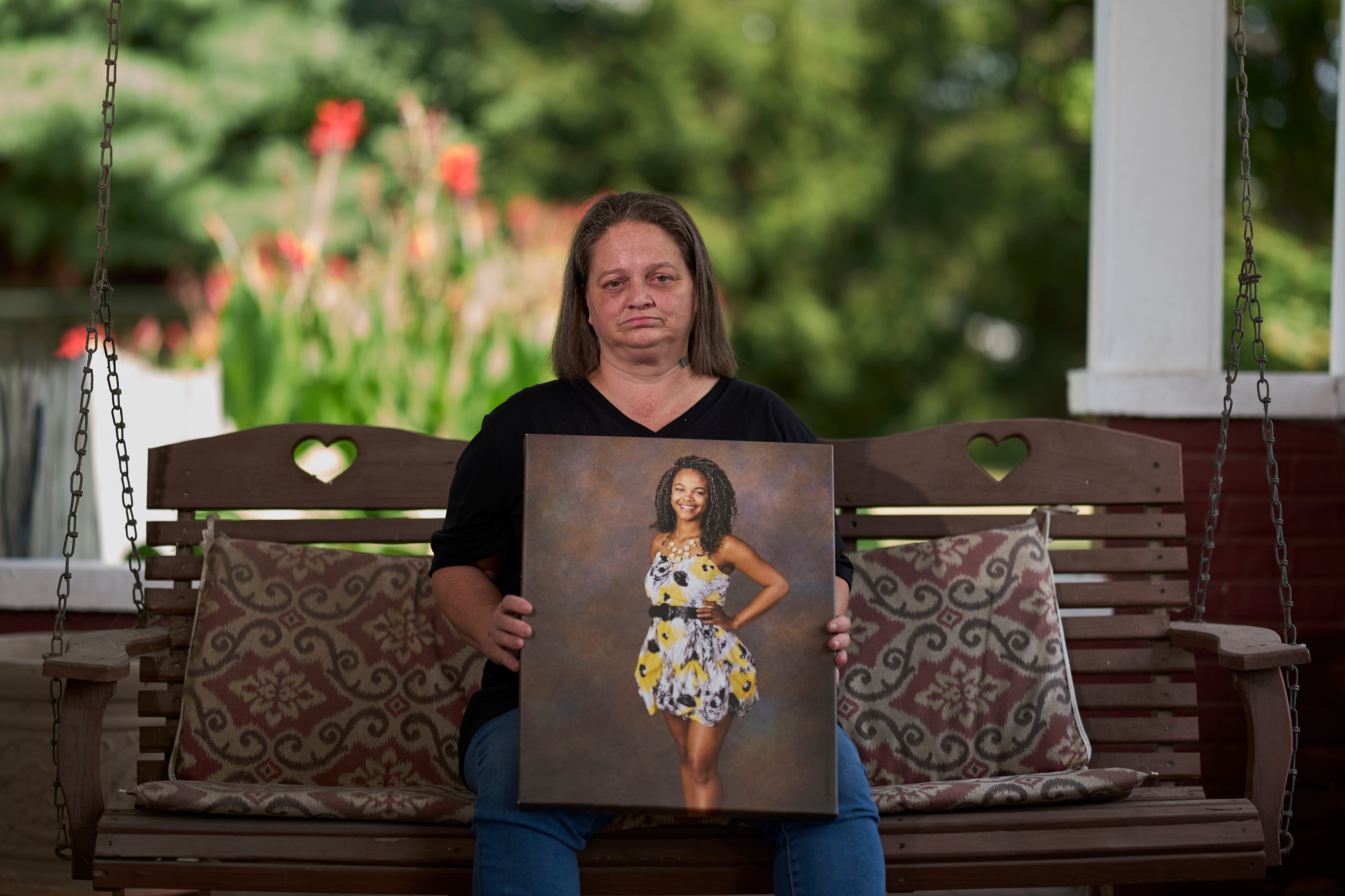 Christy Spivey poses with a portrait of her late daughter, Tasia Fortune, on Tuesday, Sept. 8, 2026, in Marion, Ky. 