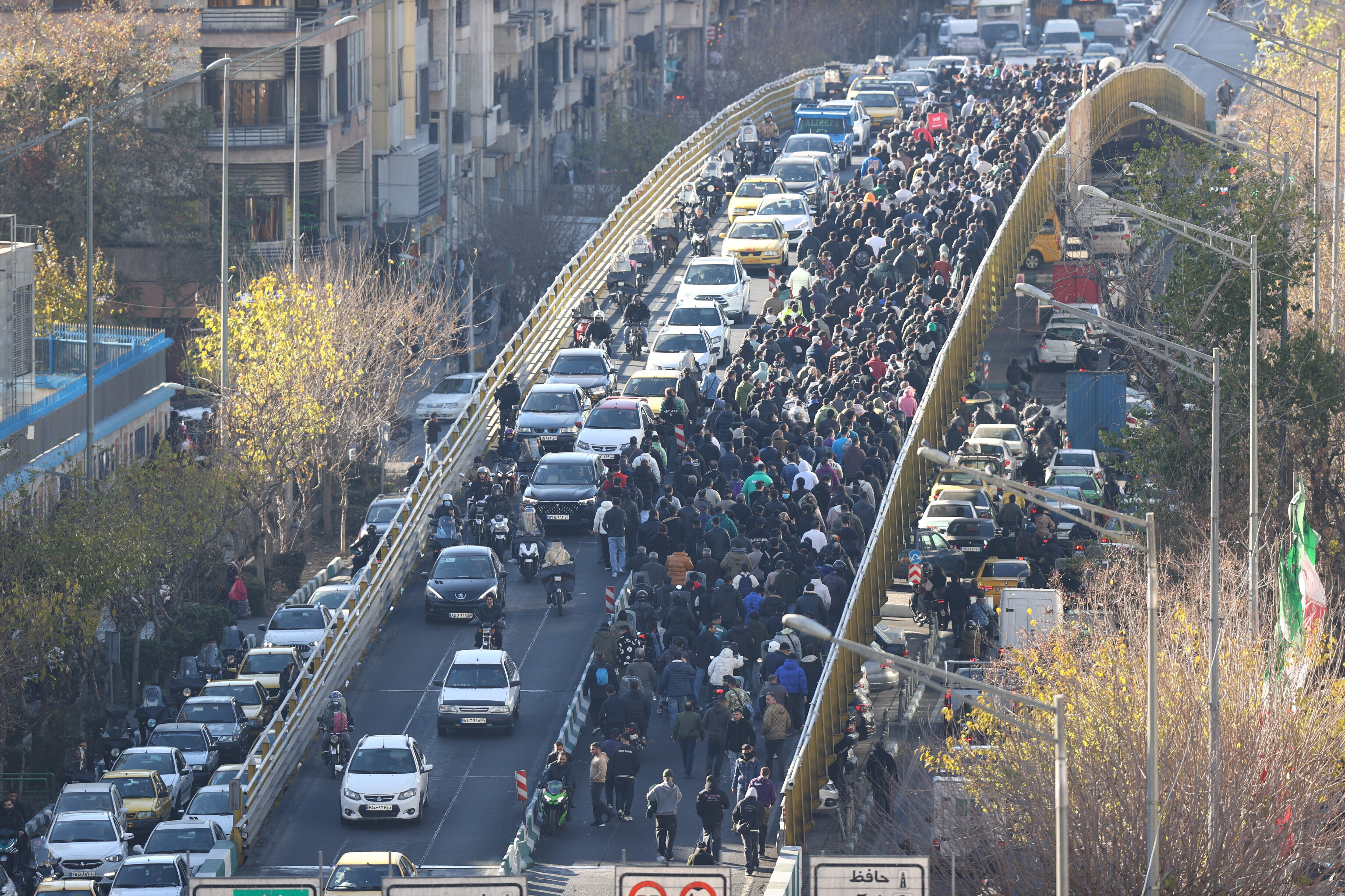 FILE - Protesters march on a bridge in Tehran, Iran, on Dec. 29, 2025. 