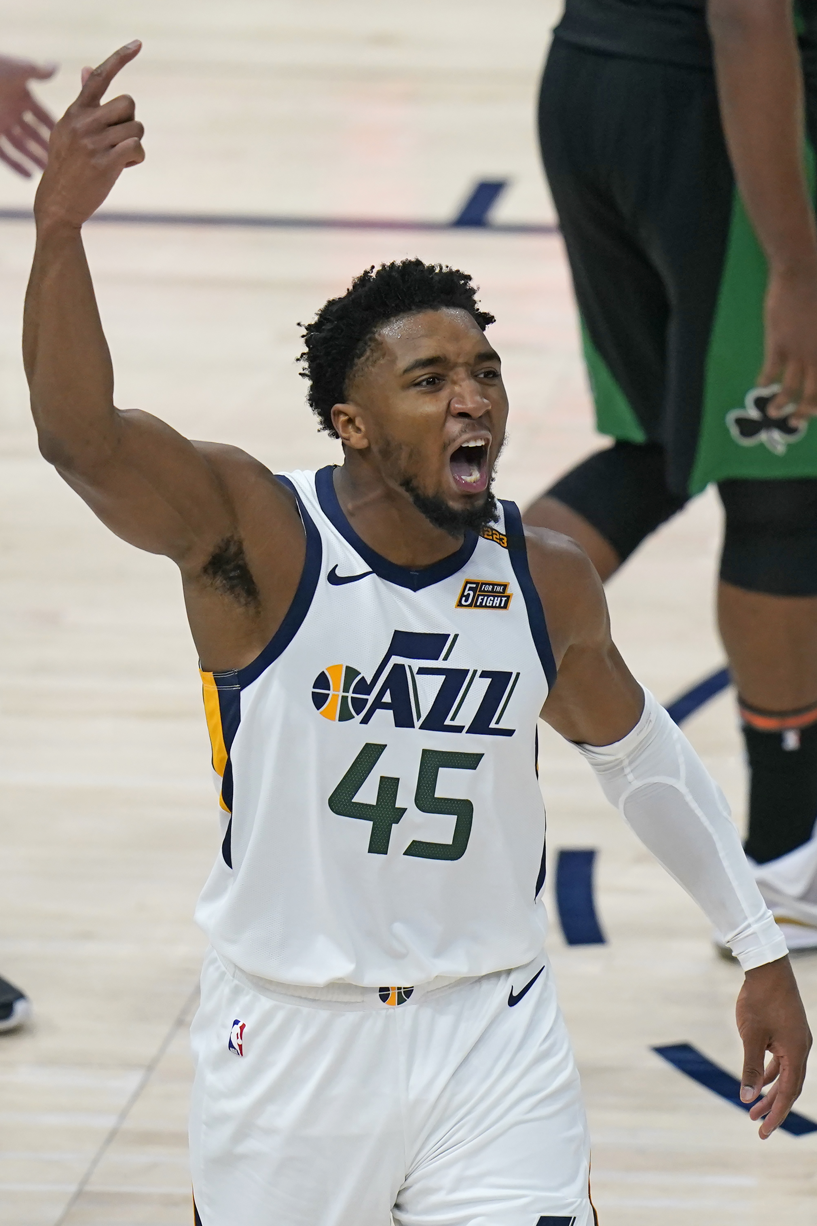 Utah Jazz guard Donovan Mitchell (45) celebrates after scoring against the Boston Celtics in the second half during an NBA basketball game Tuesday, Feb. 9, 2021, in Salt Lake City. (AP Photo/Rick Bowmer)

