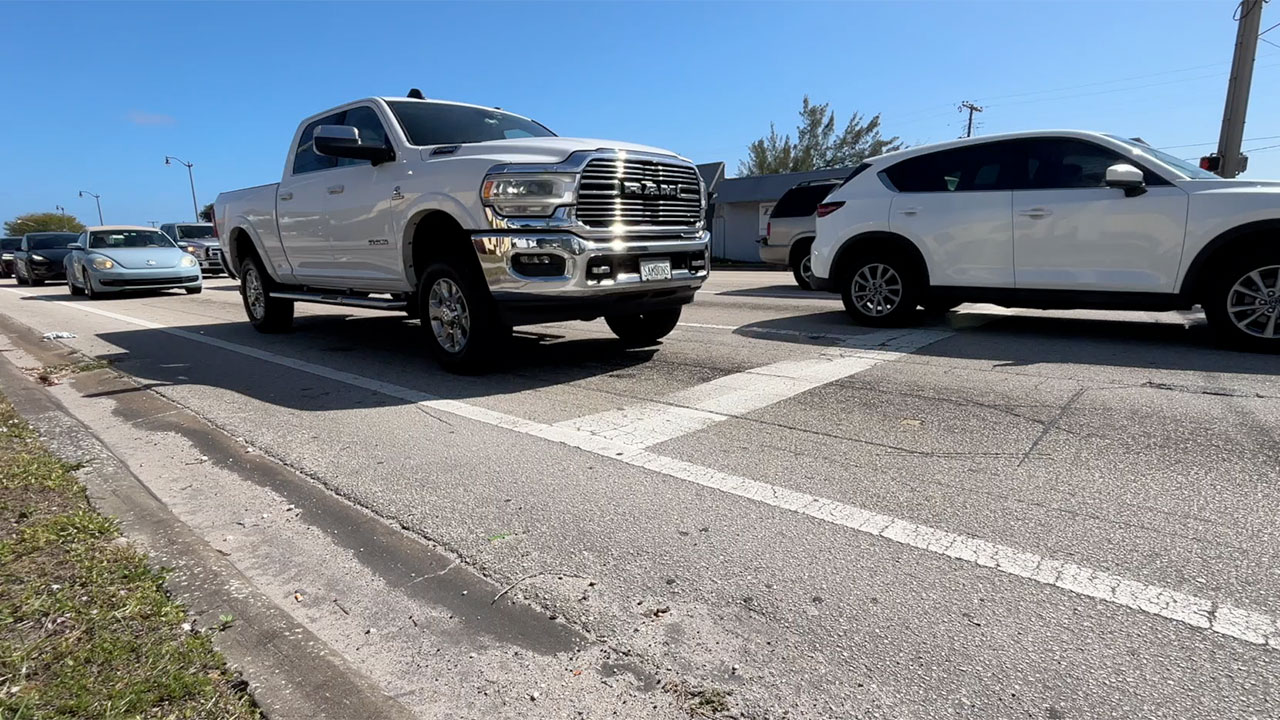 Cars, trucks on road