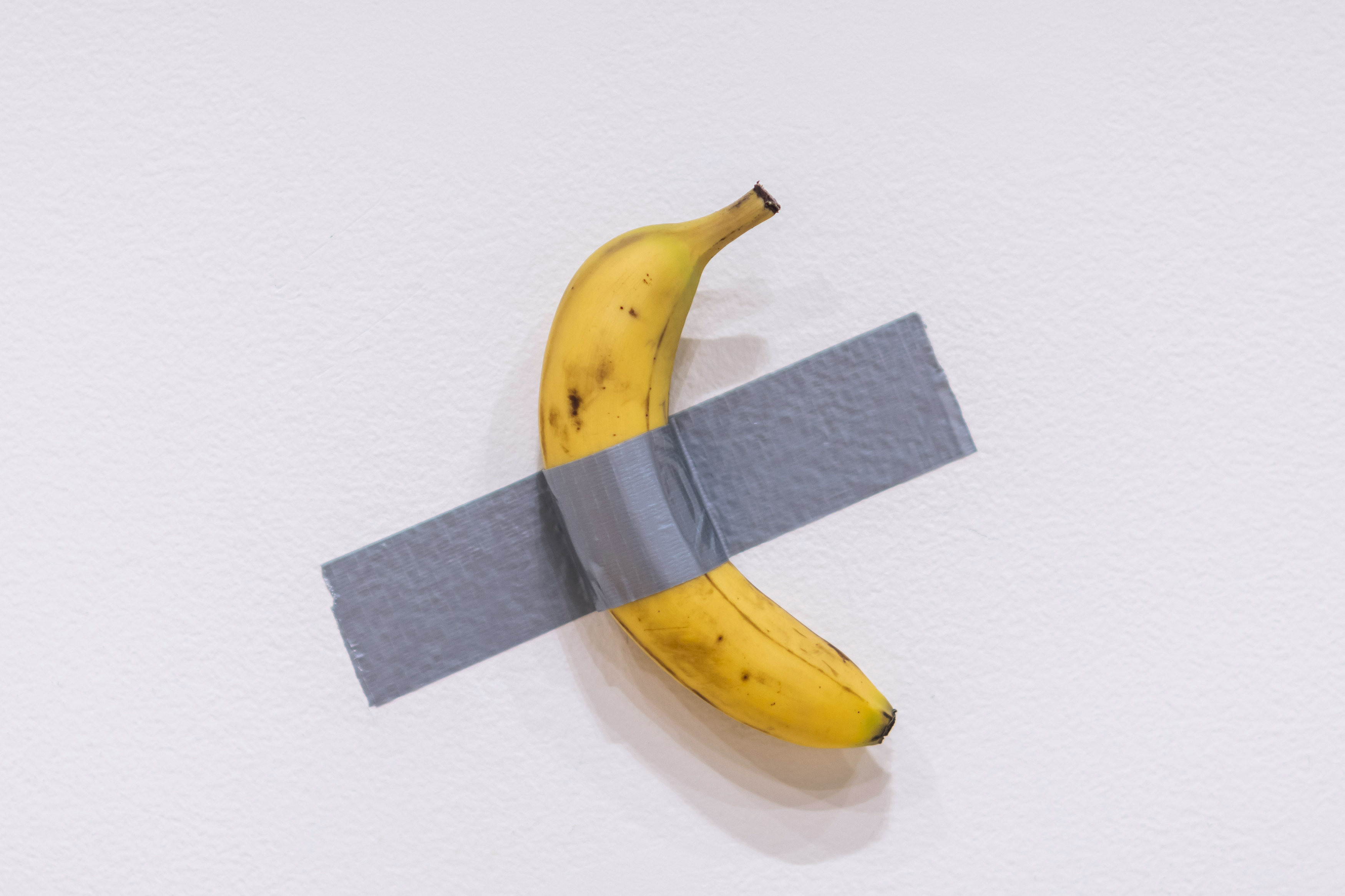 Artist Maurizio Cattelan's piece of art "Comedian" hangs on display during an auction preview at Sotheby's in New York.