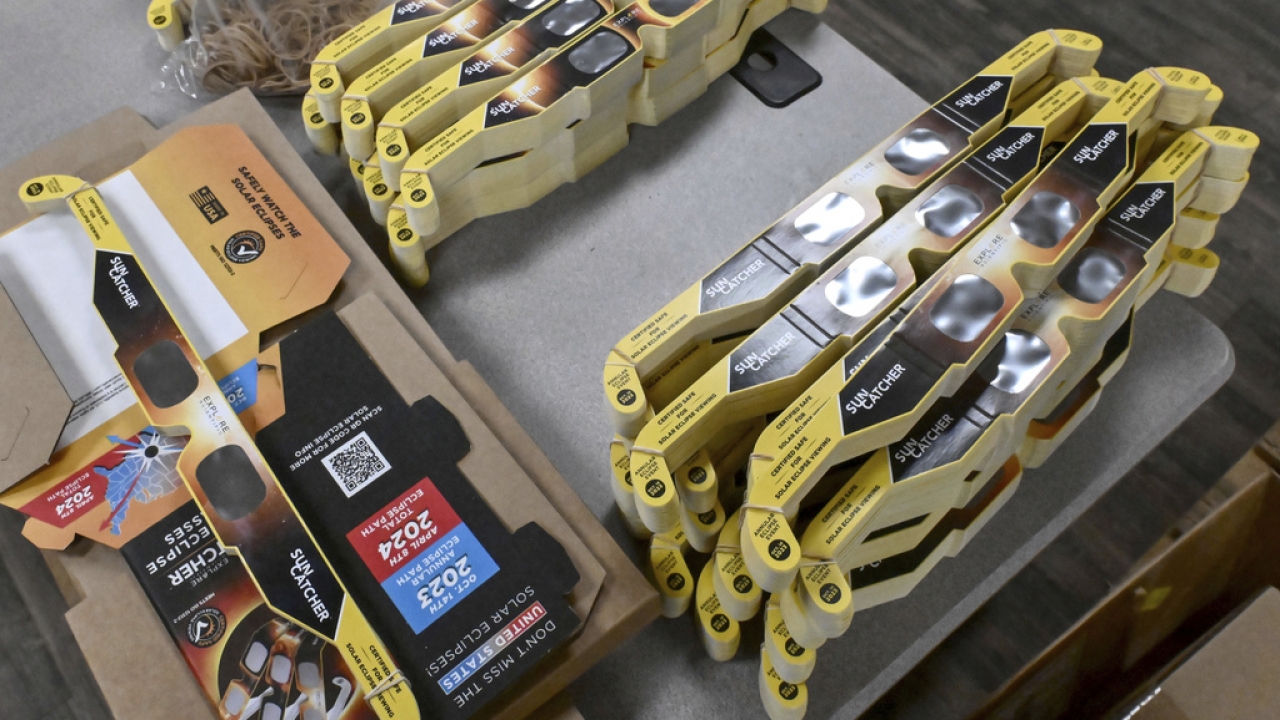 Stacks of Sun Catcher solar eclipse glasses wait to be packed and shipped from the Explore Scientific