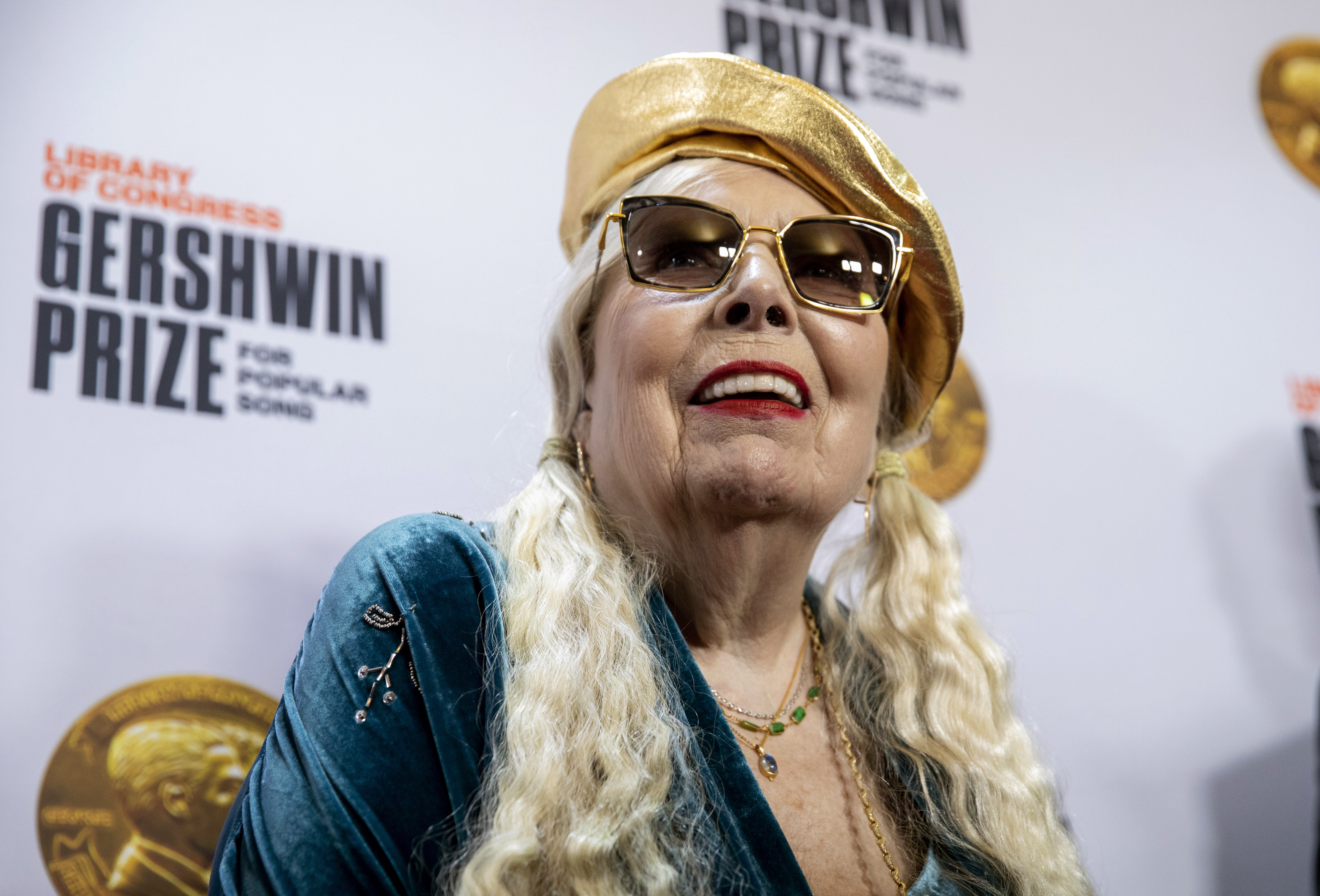 Joni Mitchell arrives at the presentation of the Gershwin Prize, which honors a musician's lifetime contribution to popular music, hosted at DAR Constitution Hall in Washington on Wednesday, March 1, 2023. Mitchell was this year's winner.