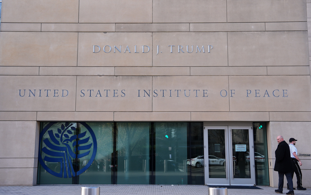 FILE - President Donald Trump's name is seen on the U.S. Institute of Peace building, Dec. 4, 2025, in Washington.