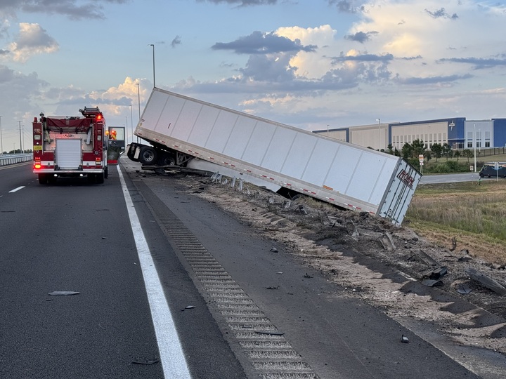 Truck dangles off overpass on Florida highway