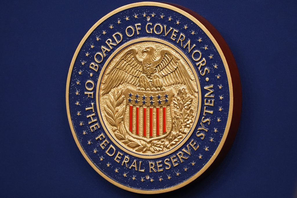 The Federal Reserve Chair logo appears on a podium at the Federal Reserve, Wednesday, Dec. 10, 2025, in Washington. 