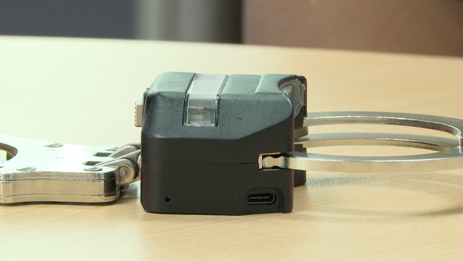 Biometric handcuffs on table