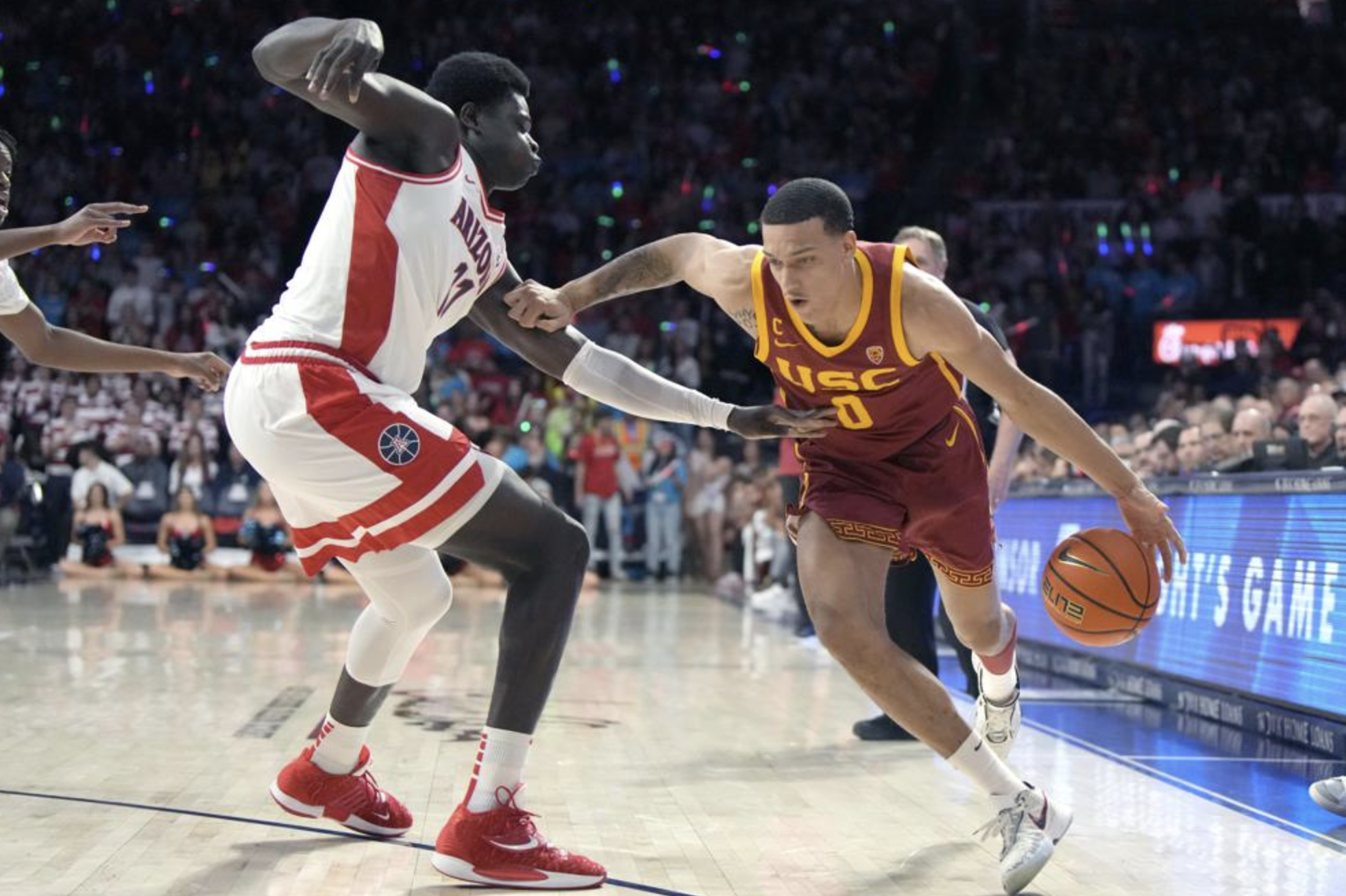 Kobe Johnson drives on Oumar Ballo