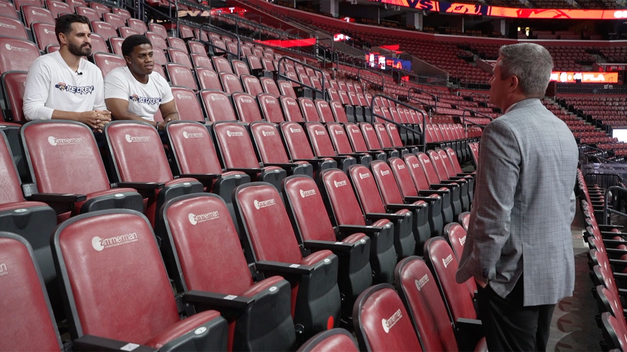 WPTV anchor Mike Trim talks with members of the Panthers Ice Crew at Amerant Bank in Sunrise, Florida.