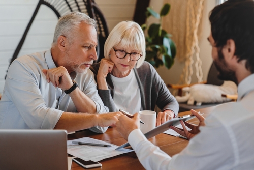 Older clients consulting with a professional about estate planning.