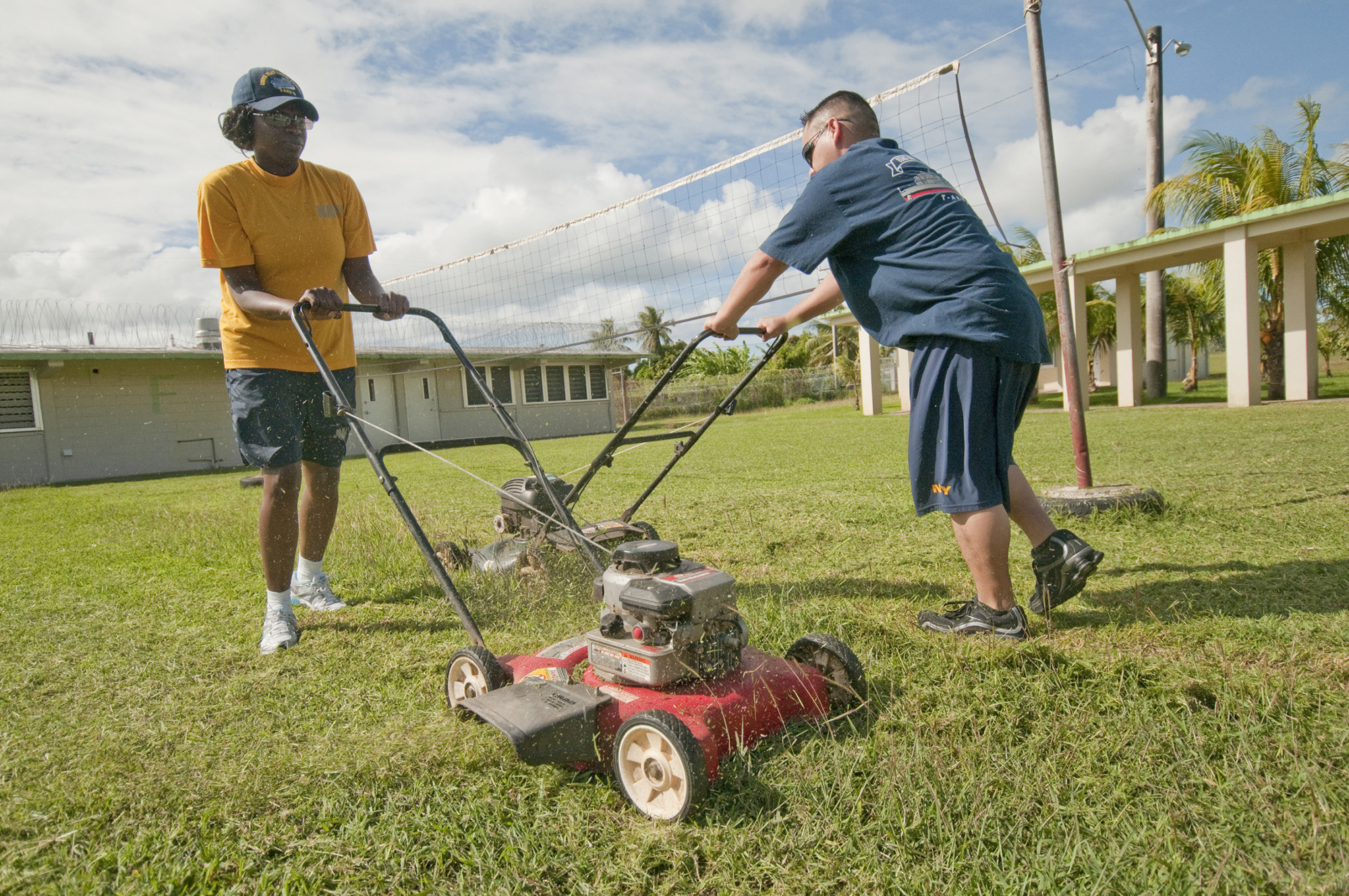 USNS Matthew Perry Sailors Do Yardwork in Guam lawnmower