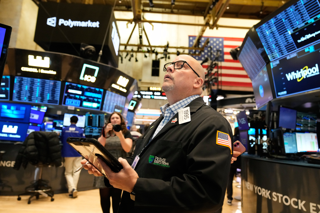 Jeffrey Vazquez works on the floor at the New York Stock Exchange in New York, Thursday, Nov. 13, 2025.