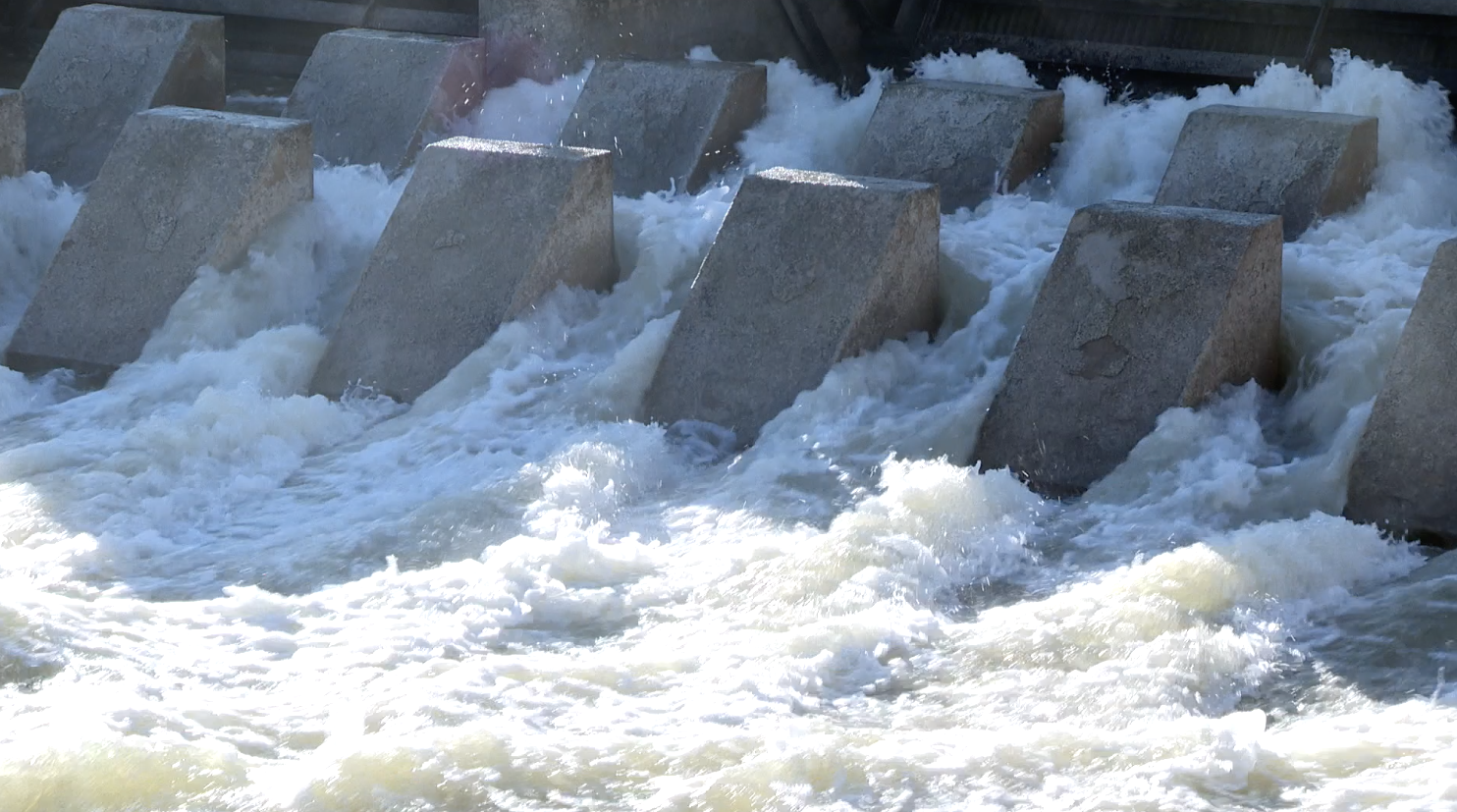 Water spills through the head gates at Murtaugh Lake on Wednesday, March 26, 2025