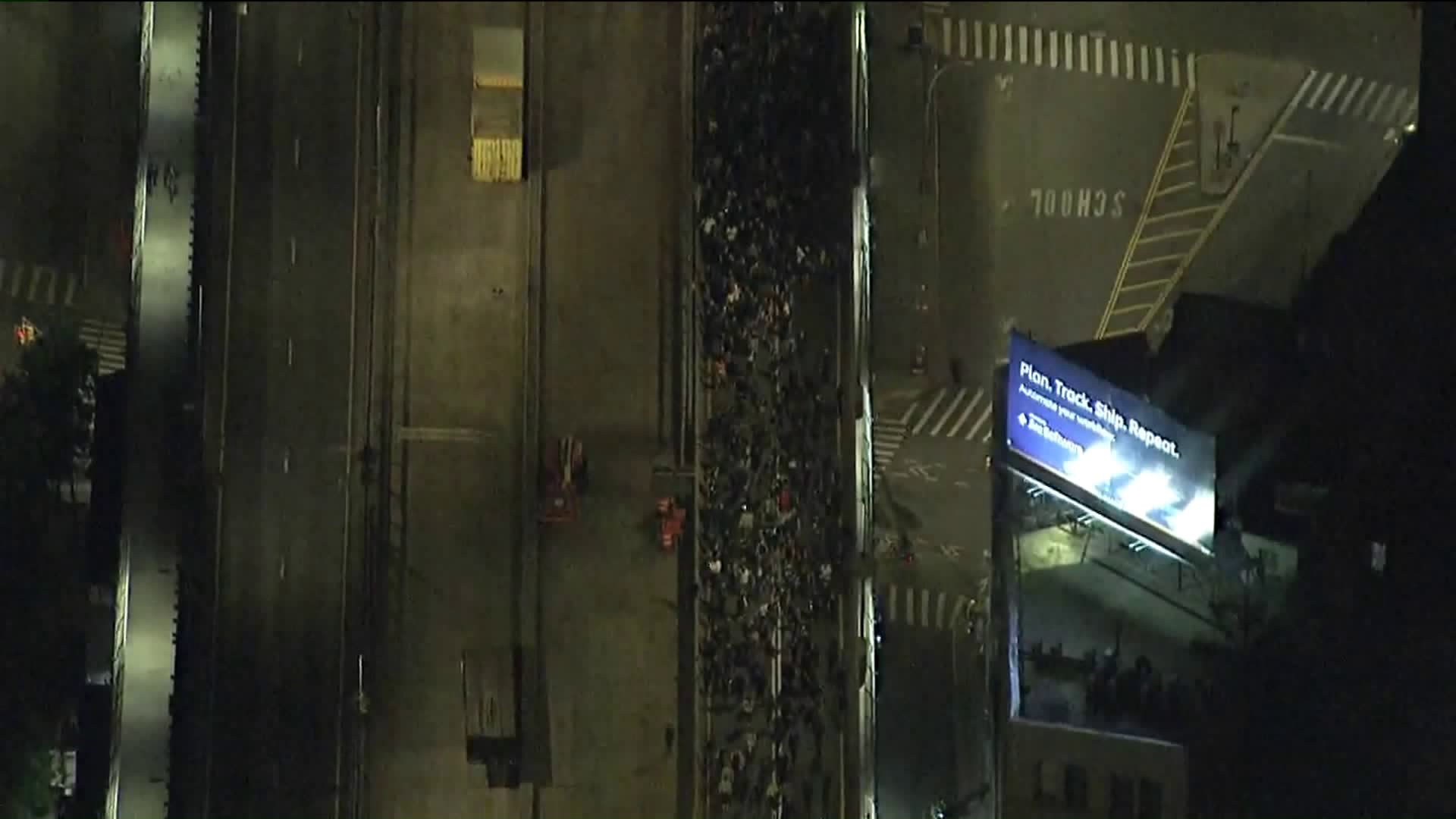 Peaceful protesters in New York briefly stranded bridge after NYPD blockaded each side