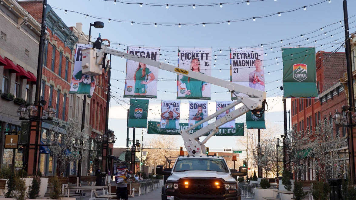 putting up Denver Summit flags