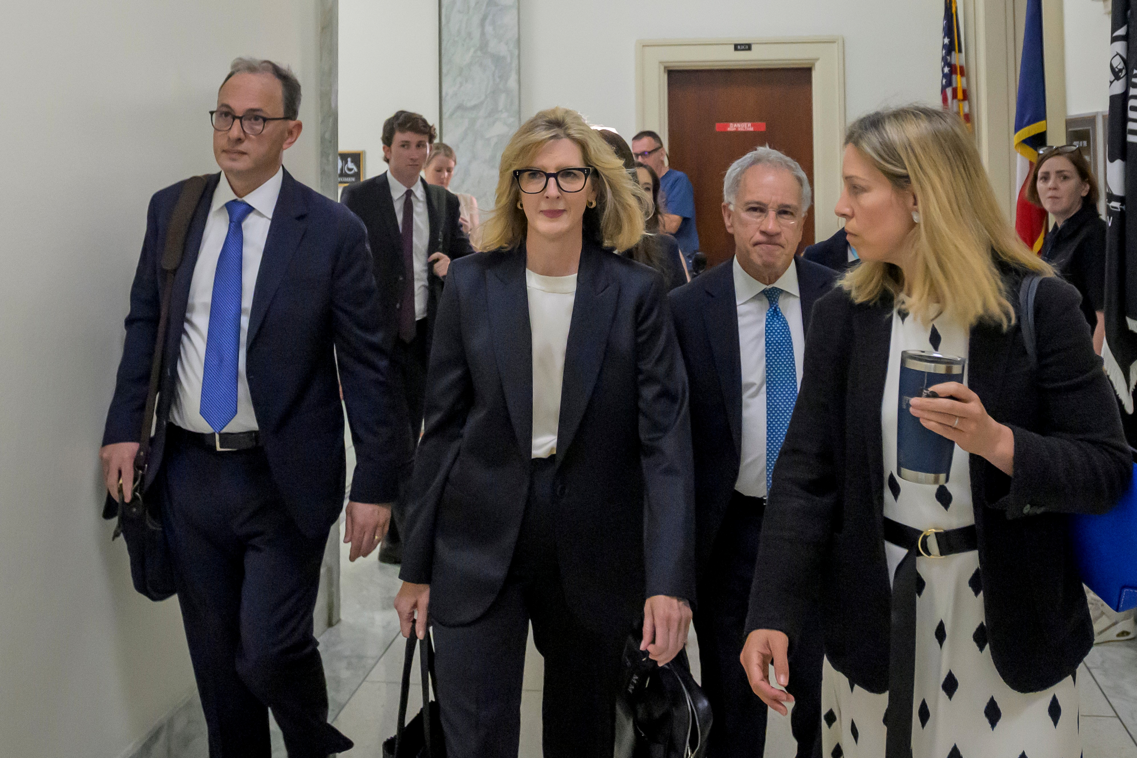 Goldman Sachs senior counsel Kathryn Ruemmler, center, arrives for a House Committee on Oversight and Government Reform hearing regarding her ties to Jeffrey Epstein, on Capitol Hill, Wednesday, July 15, 2026, in Washington.