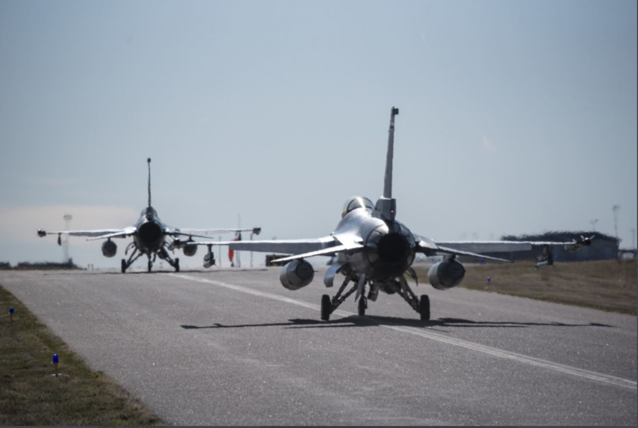 Two F-16 Fighting Falcon aircraft from the 120th Fighter Squadron, Colorado Air National Guard taxi towards the runway during a practice alert scramble, Buckley Air Force Base, Aurora, Colorado, Mar. 31, 2020. 