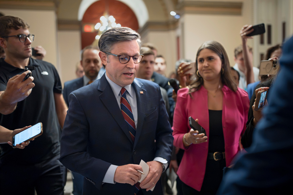 Speaker of the House Mike Johnson, R-La., is surrounded by reporters as he heads to the chamber for a series of votes on President Donald Trump's priorities at the Capitol in Washington, Wednesday, July 22, 2026. 