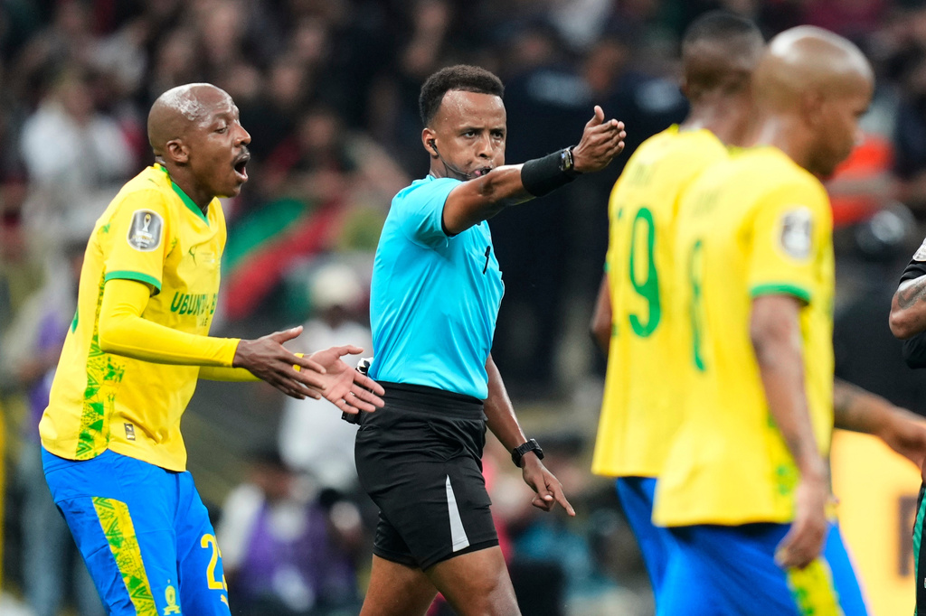 FILE - Referee Omar Artan, center, signals a penalty during the CAF Champions League final soccer match between AS FAR Rabat and Mamelodi Sundowns, in Rabat, Morocco, Sunday, May 24, 2026. 