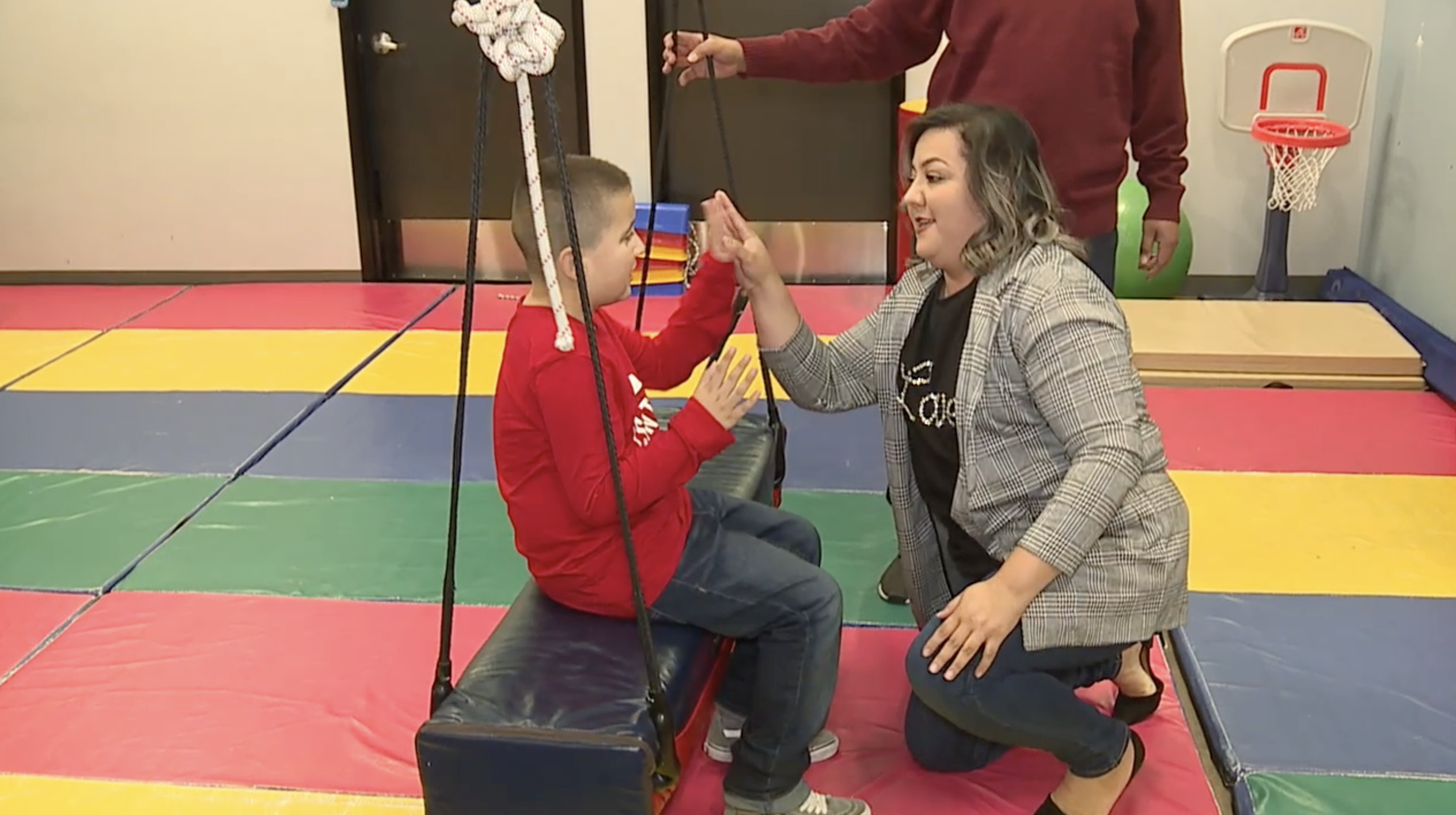 Erandy Estrada with her son. The Touro University program helps children on the spectrum.
