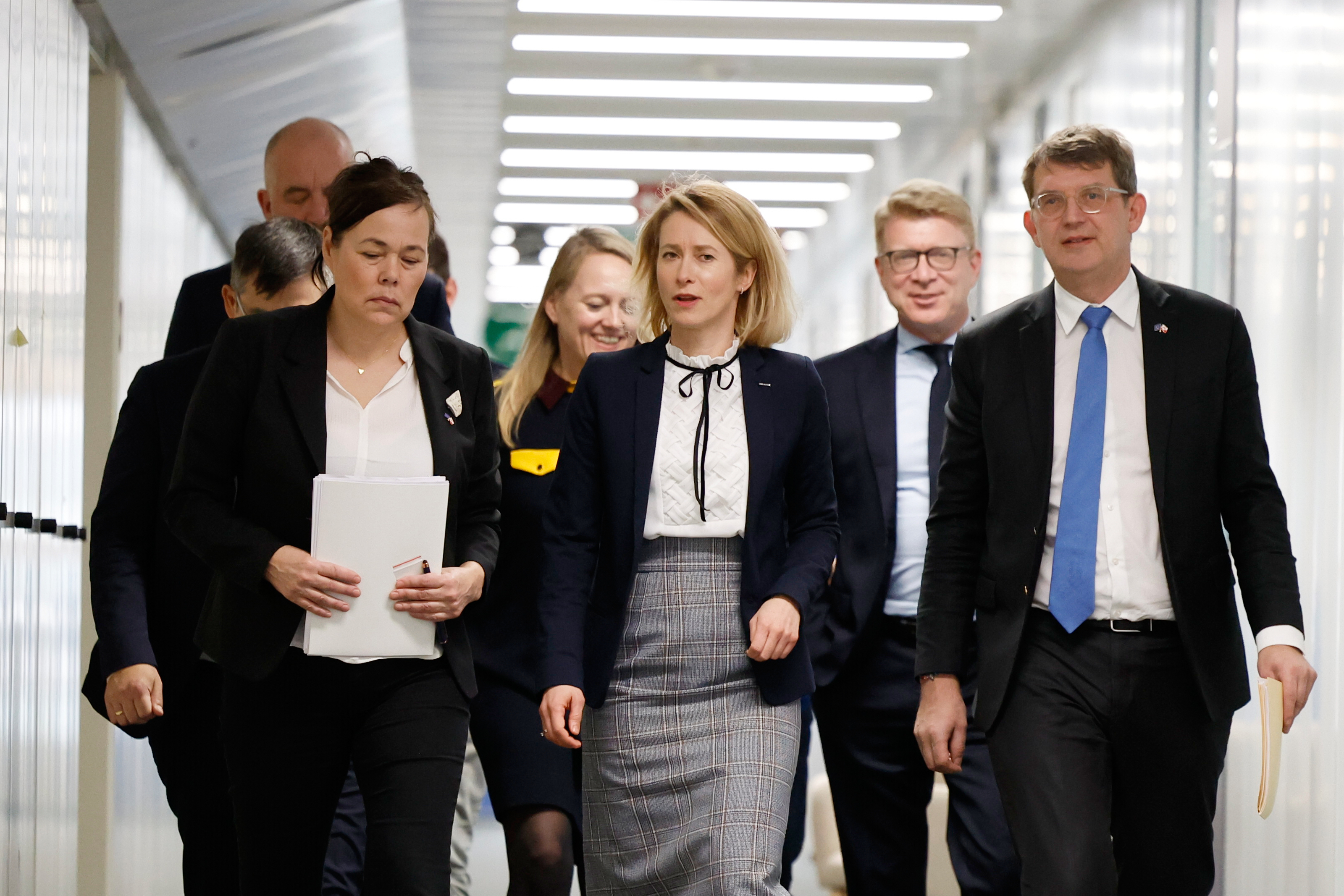 European Union foreign policy chief Kaja Kallas, center, walks with Minister for Foreign Affairs and Research of Greenland Vivian Motzfeldt, front left, and Denmark's Defense Minister Troels Lund Poulsen, front right, prior to a meeting at EU headquarters in Brussels, Monday, Jan. 19, 2026. 