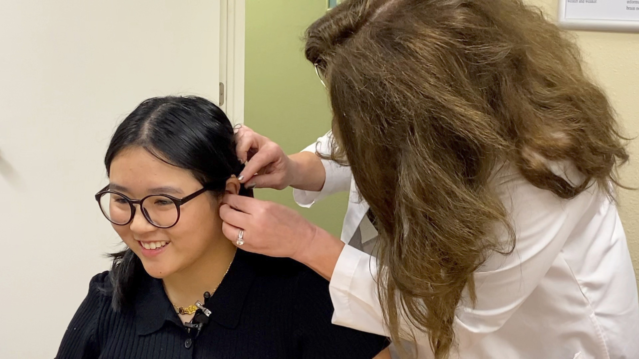 USF student receives hearing aids, hears out of ear for first time