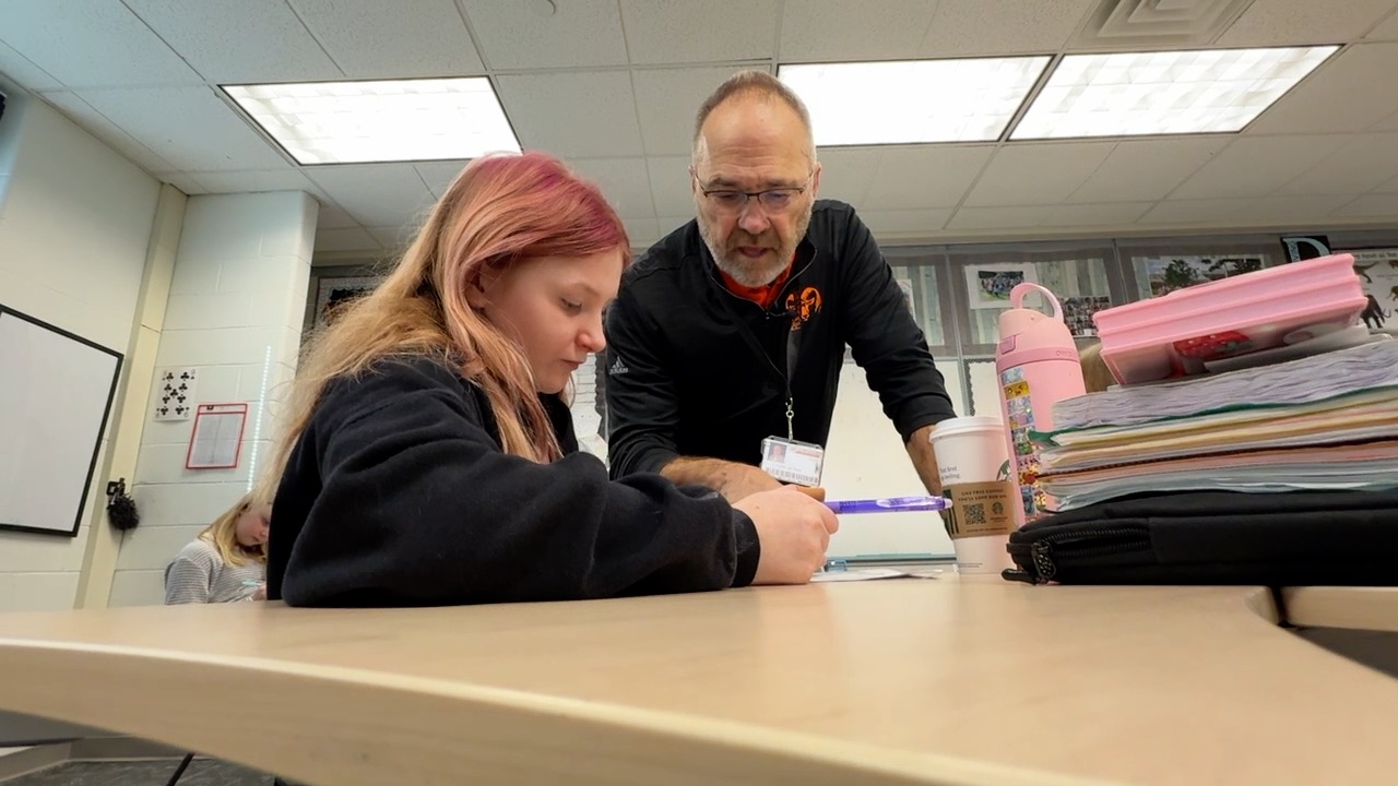 Dr Matthews and student at desk.jpg