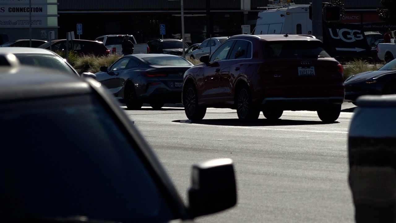 Convoy Street is busy with cars on a Tuesday afternoon