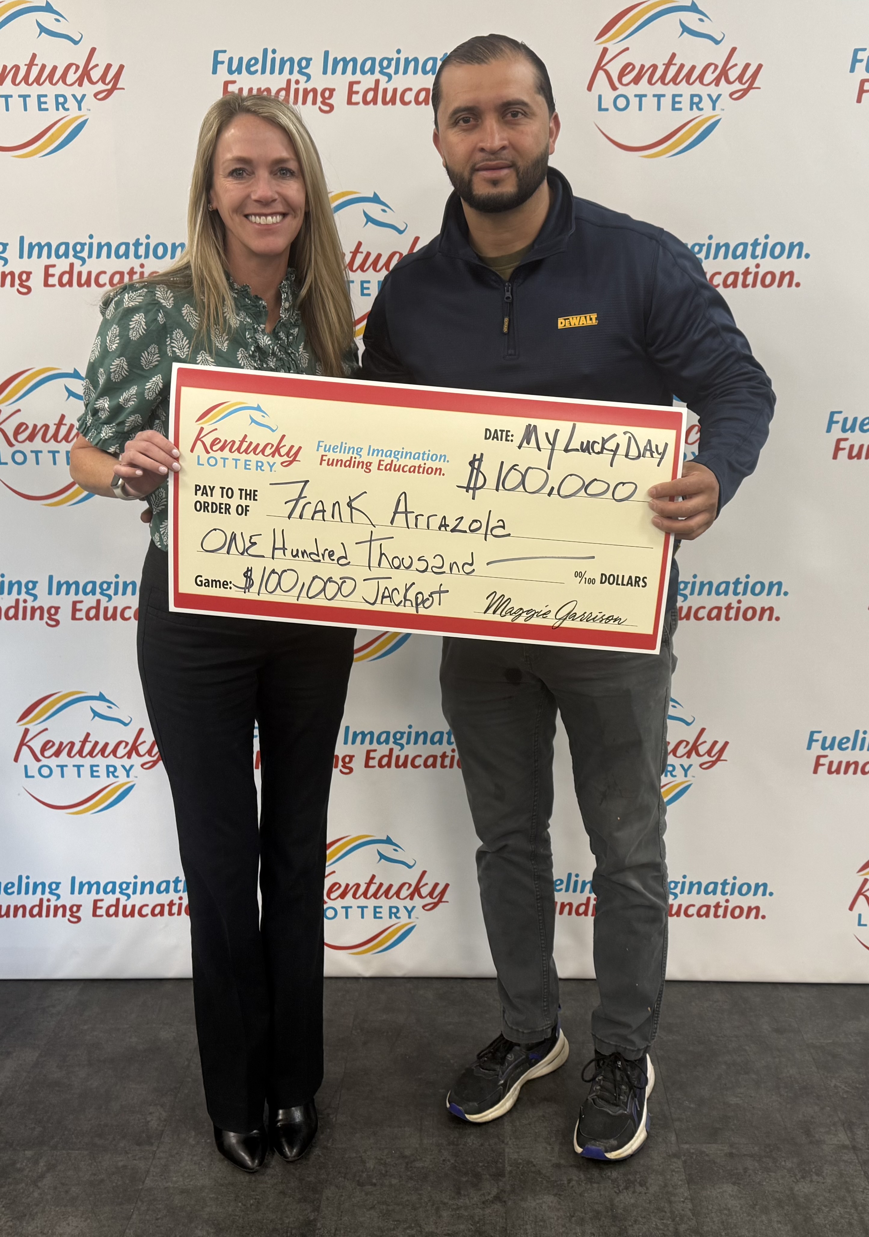 Frank Arrazola with Lottery President and CEO Maggie Garrison.jpeg
