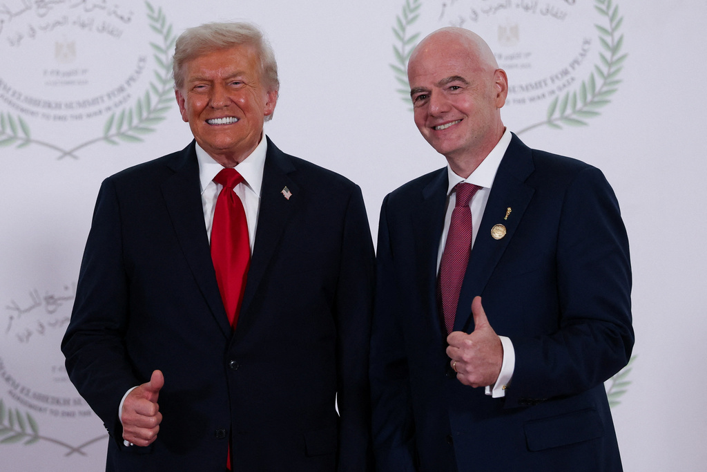 President Donald Trump and FIFA president Gianni Infantino pose for a photo in Sharm el-Sheikh, Egypt.
