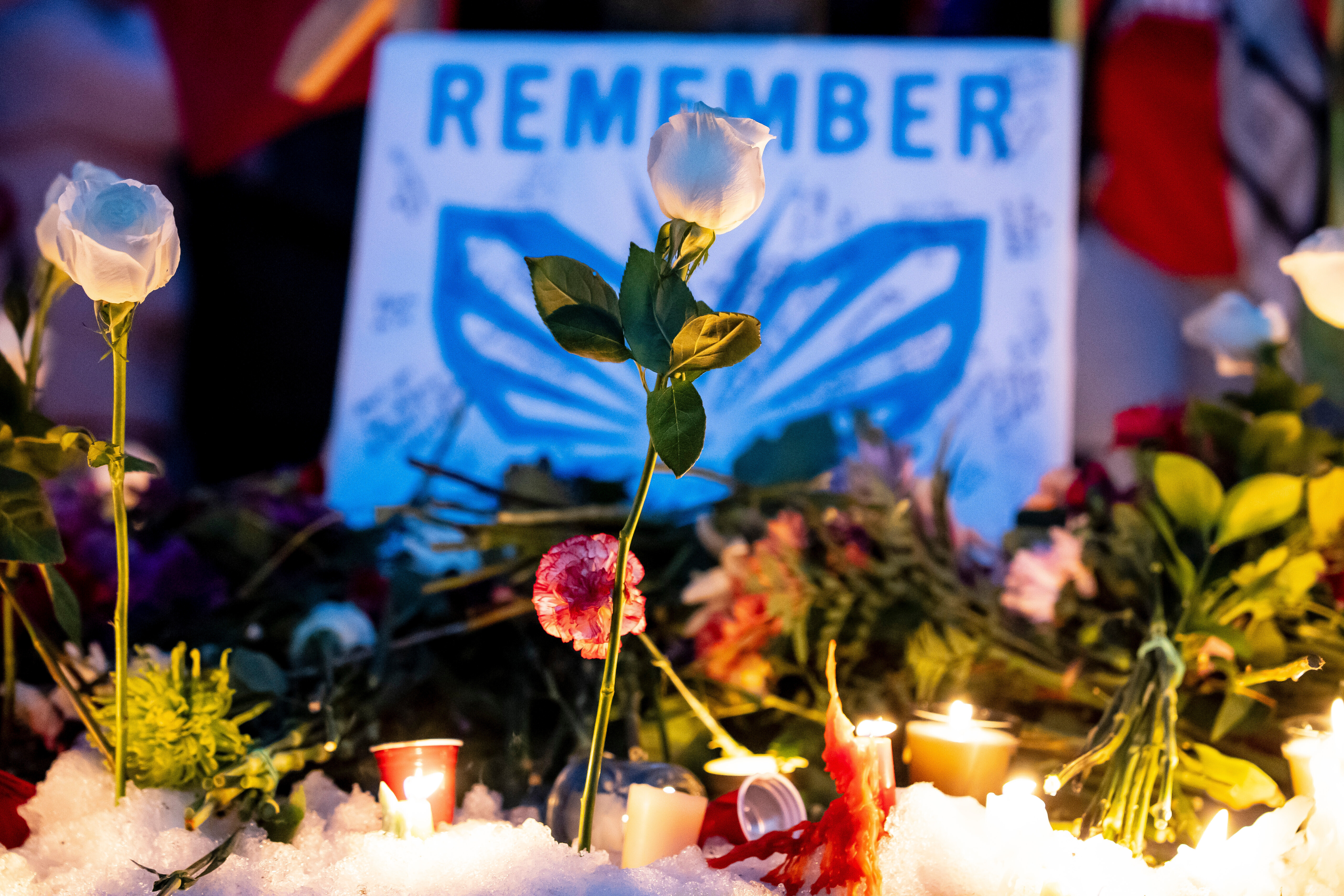 Flowers are seen at a protest and vigil after an Immigration and Customs Enforcement officer shot and killed a woman in Minneapolis, on Wednesday, Jan. 7, 2026. 