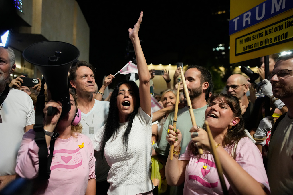 Einav Zangauker, center, mother of Matan Zangauker, who is being held hostage by Hamas, reacts as she and others celebrate following the announcement that Israel and Hamas have agreed to the first phase of a peace plan to pause the fighting.