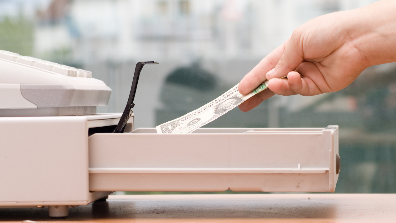 Money Being Put in a Cash Register (FILE)