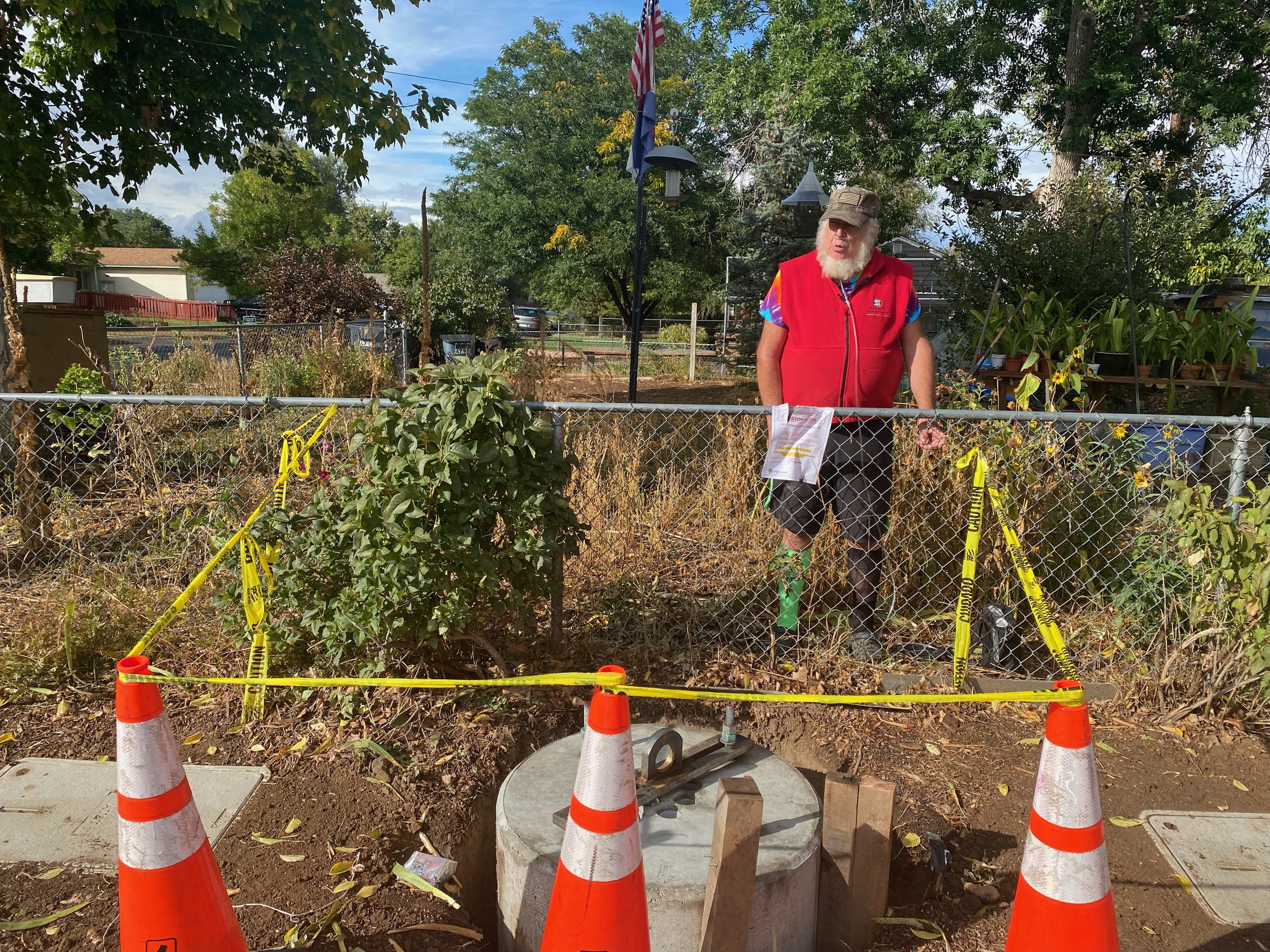 Richard Rice stands at his property line where the base of a 5G tower was set on Monda