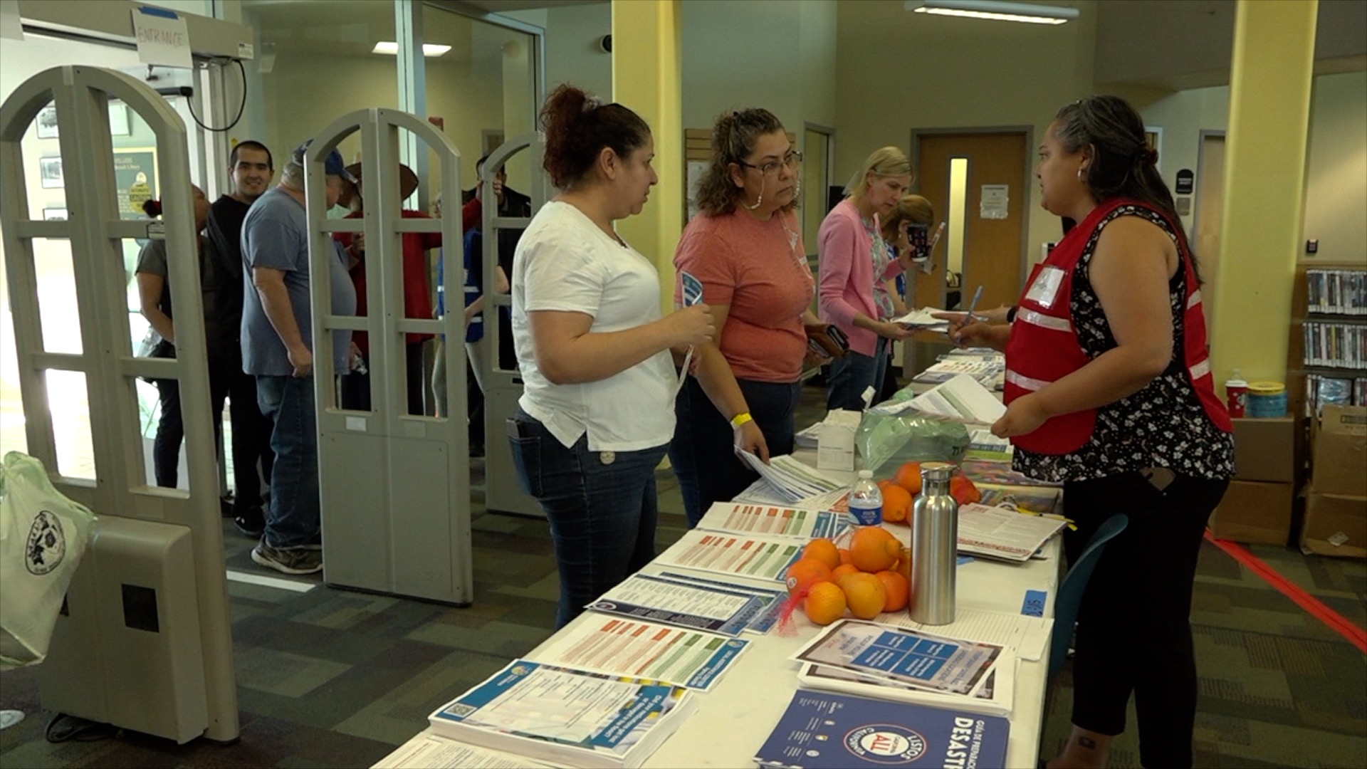 Volunteers check-in flood victims looking for resources at the Spring Valley Library.