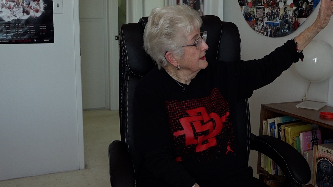Bette Boucher's office is full of pictures from her time cheering on SDSU.