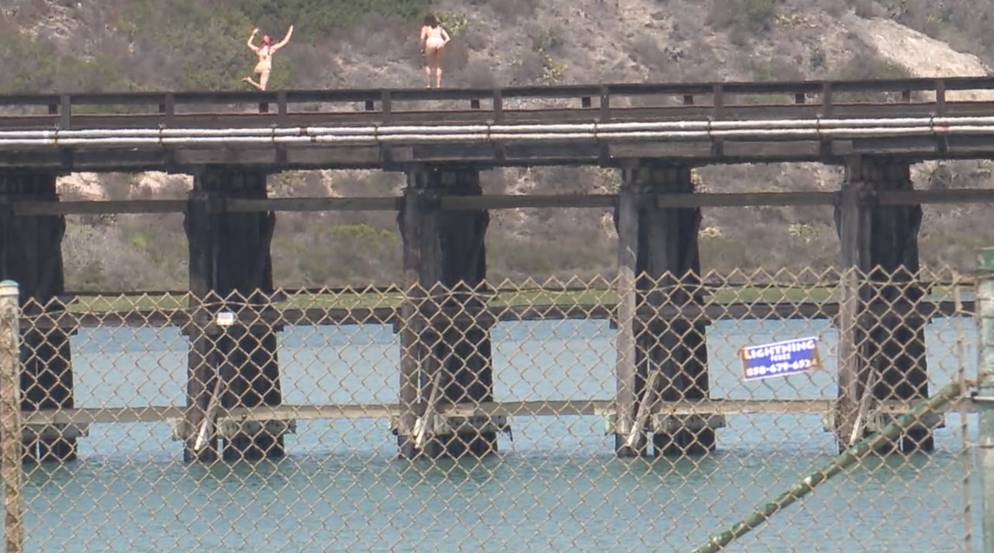 Teens jump into Batiquitos Lagoon