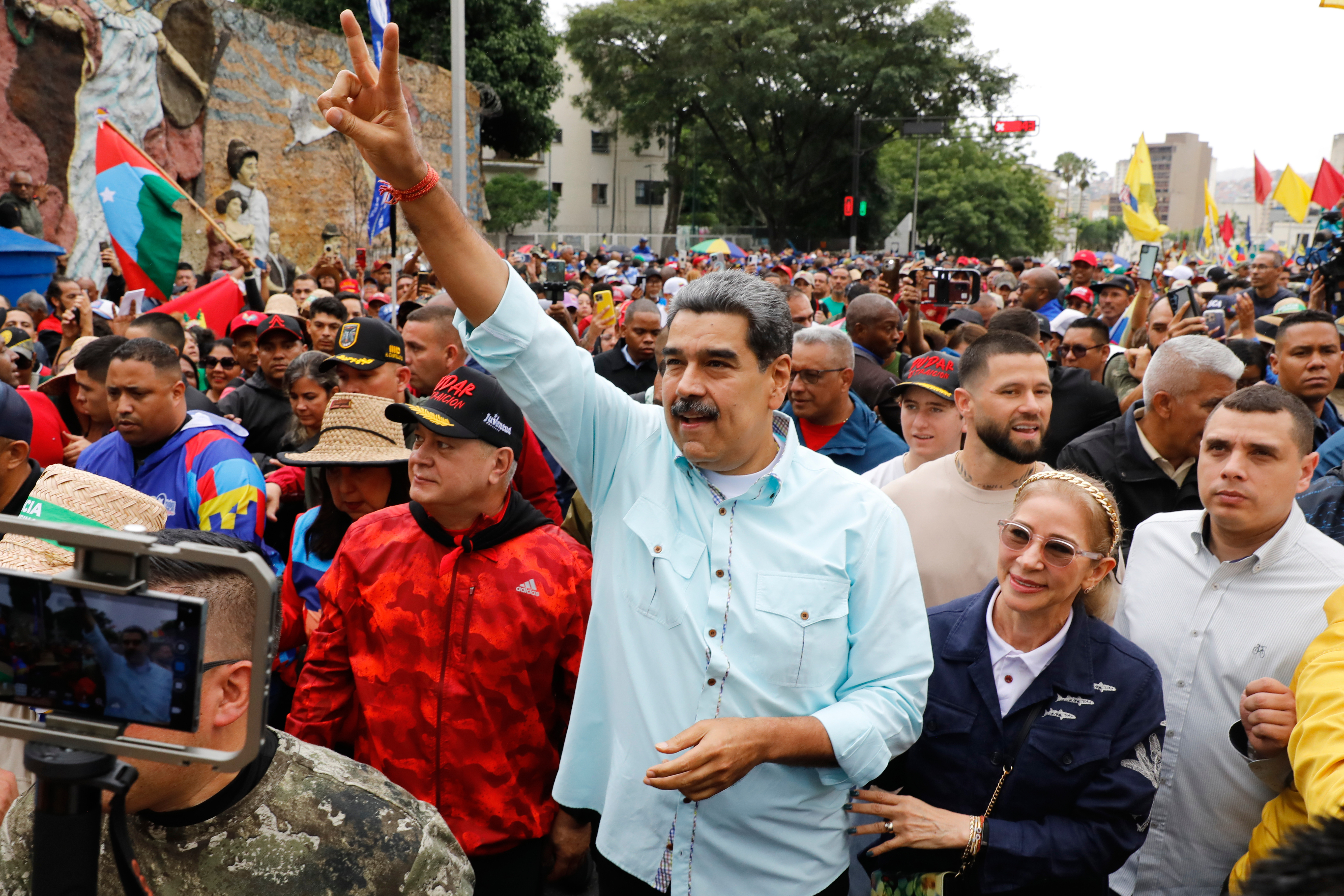 President Nicolas Maduro joins a rally marking the anniversary of the Battle of Santa Ines, which took place during Venezuela's 19th-century Federal War, in Caracas, Venezuela, Wednesday, Dec. 10, 2025. 