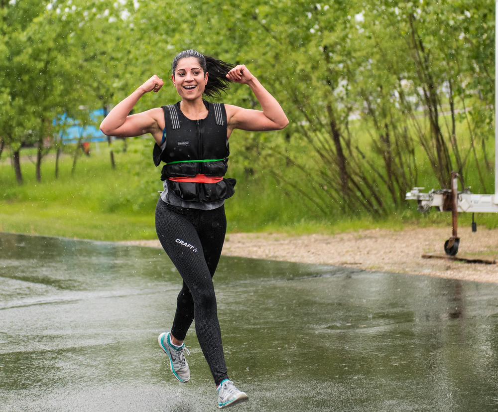 A woman wearing a weighted vest.
