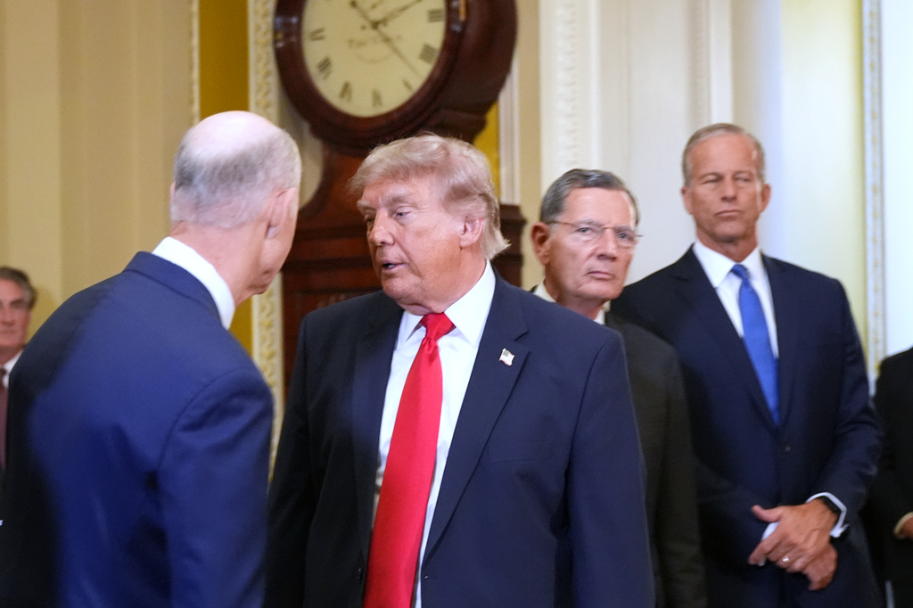 President Donald Trump turns to depart after speaking with reporters as Sen. Rick Scott, R-Fla., from left, Sen. John Barrasso, R-Wyo., and Senate Majority Leader John Thune, R-S.D., listen on Capitol Hill, Wednesday, June 24, 2026, in Washington. 