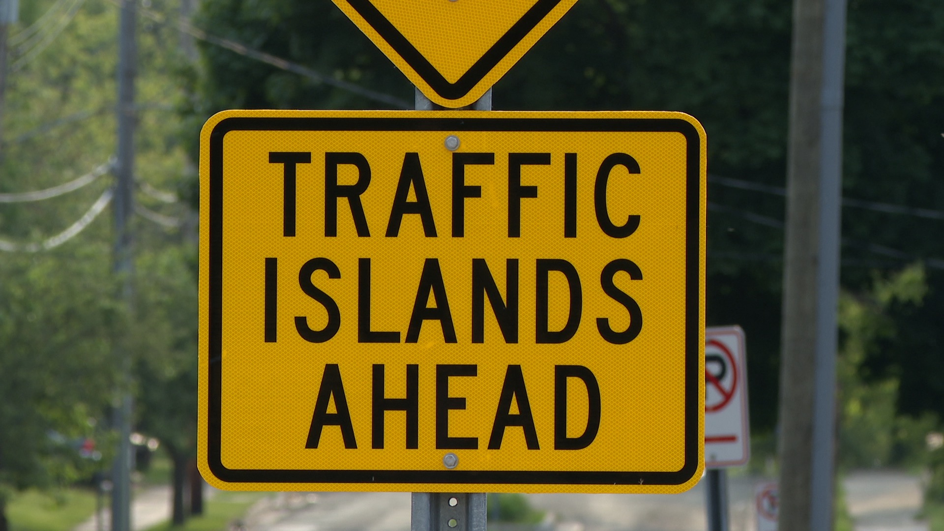 'Traffic Islands Ahead' sign on Mary Avenue in Southside Lansing