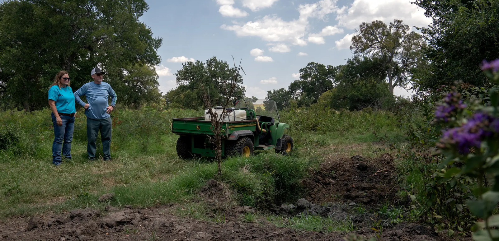 Tony and Karen Coleman stand over a plot of land where they buried a deceased calf and bull on their property in Grandview on Aug. 5, 2024.