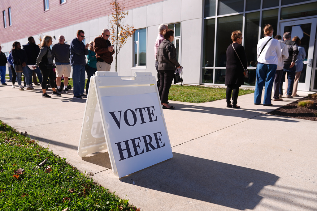 Voters wait in line to cast their ballot at a polling place at Rowan College in Mt Laurel, N.J., Oct. 27, 2025. 
