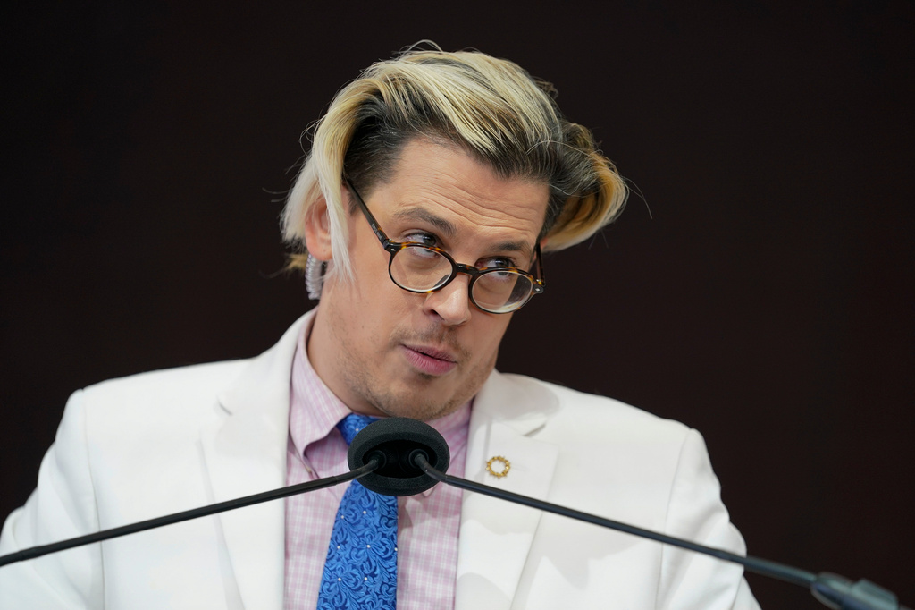 Activist Milo Yiannopoulos speaks during a rally outside of the Baltimore hotel where the United States Conference of Catholic Bishops are holding its Fall General Assembly meeting in Baltimore, Nov. 16, 2021. 