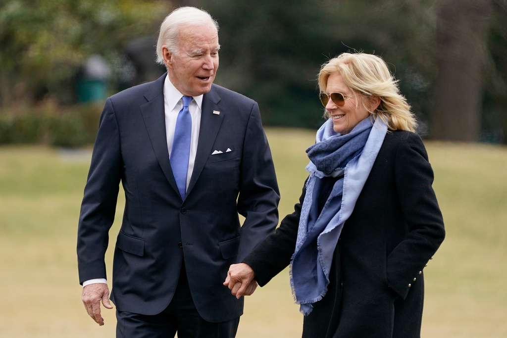 President Joe Biden and first lady Jill Biden arrive on the South Lawn of the White House, Jan. 23, 2023, in Washington.