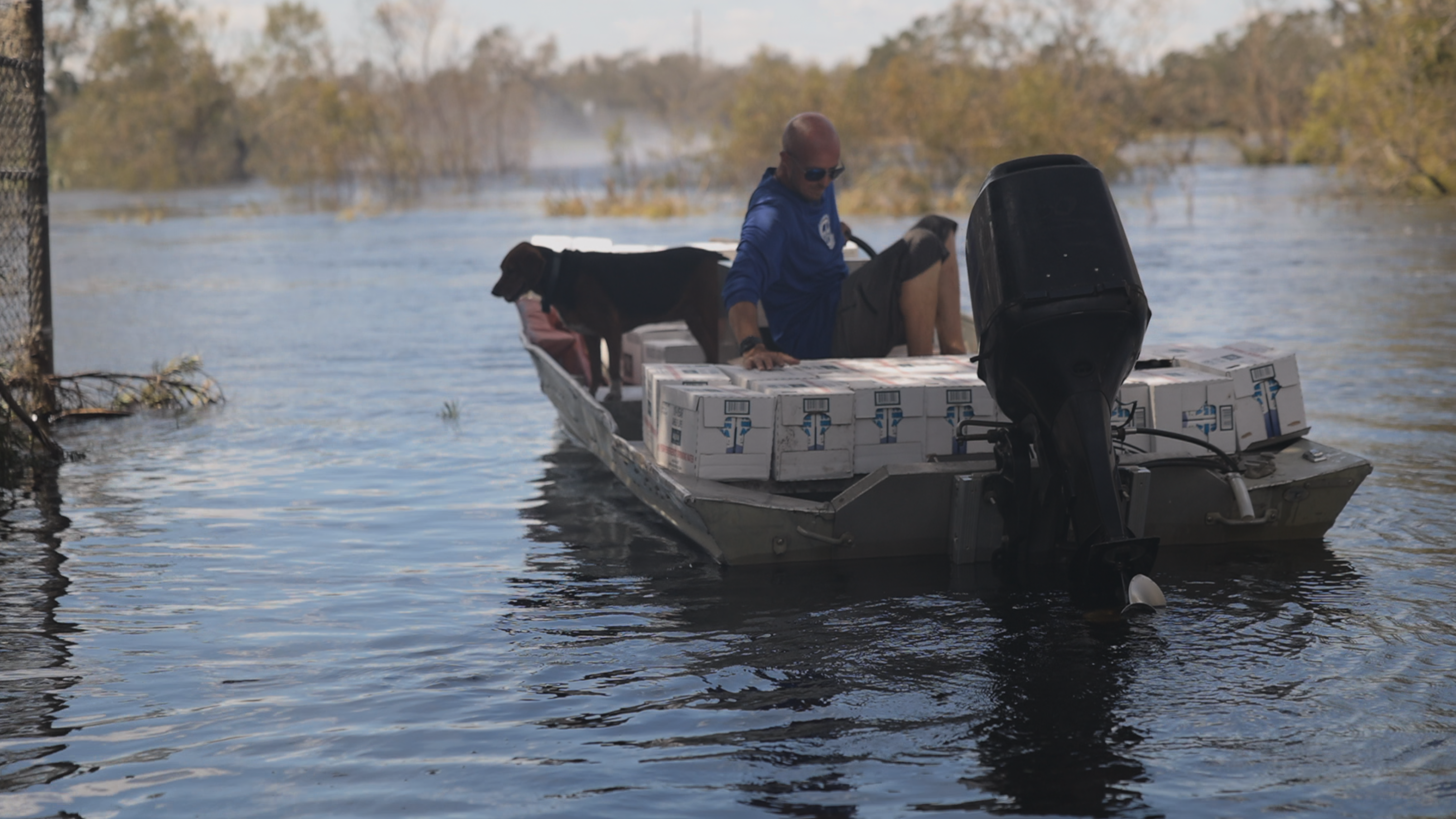 Trent Anthney unloading supplies in Arcadia along a flooded Peace River.