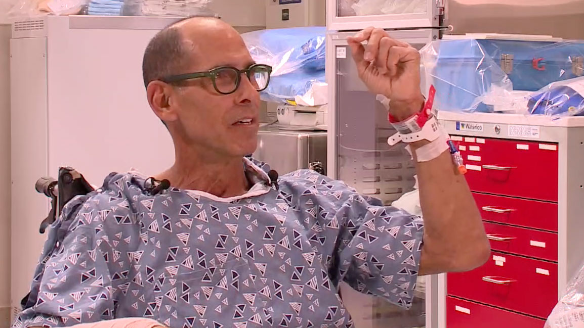 Steven Reinhardt speaks at St. Mary's Medical Center on Nov. 15, 2023, after surviving a shark attack near Juno Beach.