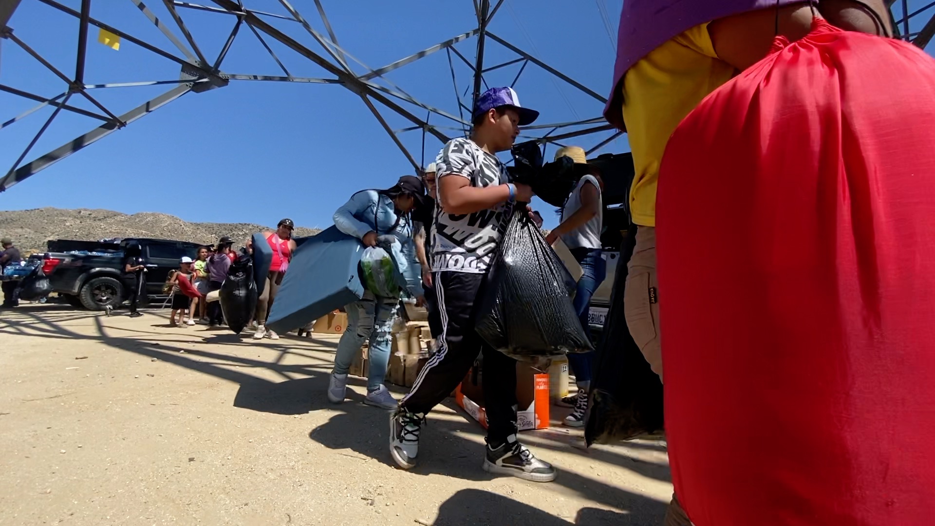Migrant in Jacumba pick up donations handed out by volunteers each day
